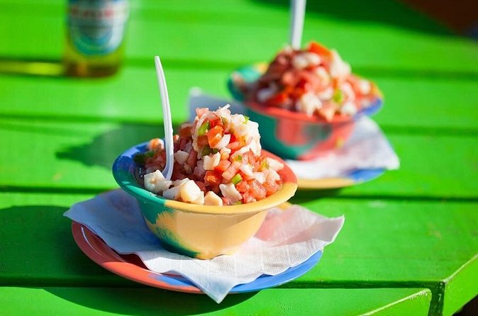Conch Salad Cooking Lesson and Tasting in Nassau - Pulling the conch from its hard shell