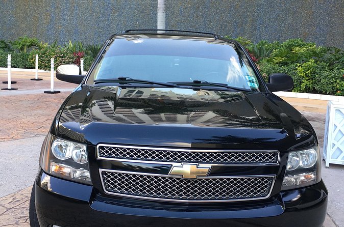 Private SUV One way Airport Transfer/Grocery & Liquor stop included - A short ride, not a sightseeing outing